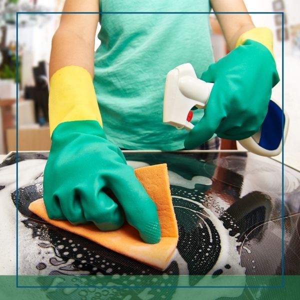 bedford woman cleaning stove